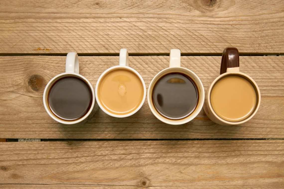 4 different mugs of strong coffee