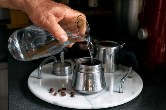 Filling Moka pot lower chamber with water to valve level