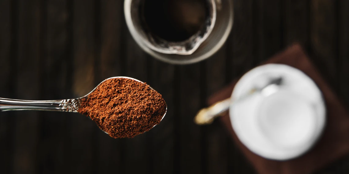 Measuring coffee grounds for Turkish coffee preparation