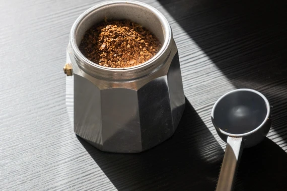 Medium-fine coffee grounds ideal for Moka pot brewing